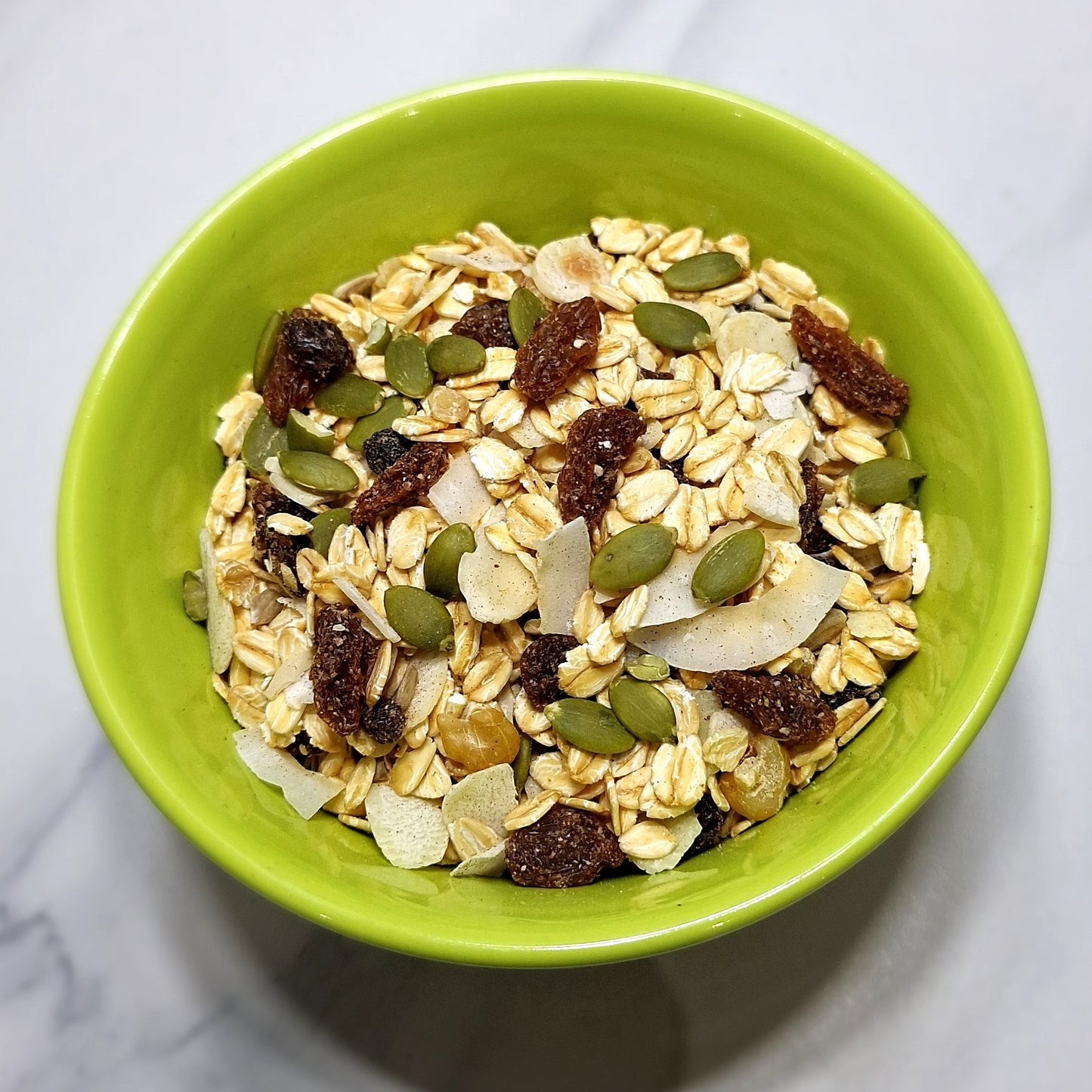 a lovely lime green bowl wiht a serve of rnage tasmania bircher muesli