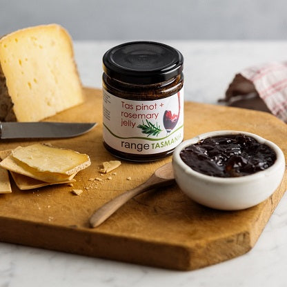 bowl of range Tasmania Tas Pinot and rosemary jelly being served with Bruny Island cheese on a wooden board.