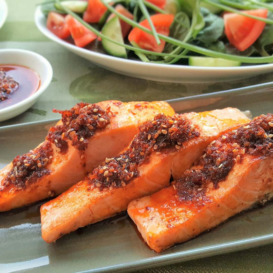 Sesame chilli oil drizzled over grilled wild salmon
