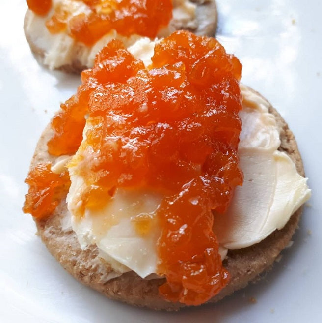 carrot and lime jam served on crackers with Tasmanian soft cream cheese