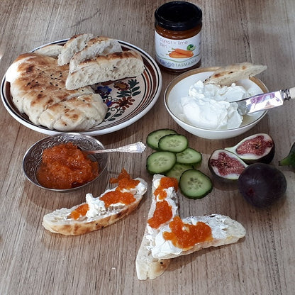 range tasmania carrot and lime jam spread on turkish bread with organic tasmanian yoghurt with sliced cucumbers and figs