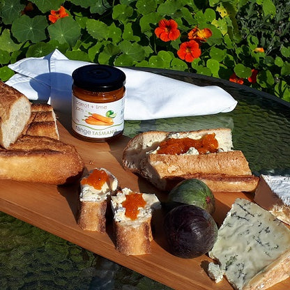 range tasmania carrot and lime jam spread on fresh french stick bread with blue cheese and figs
