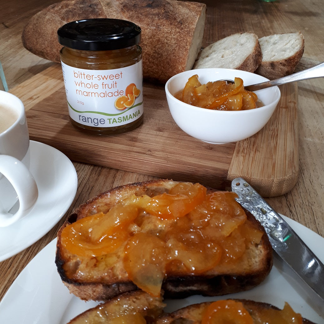 Range Tasmania bitter-sweet whole fruit marmalade spread on toasted organic sourdough with cup of tea