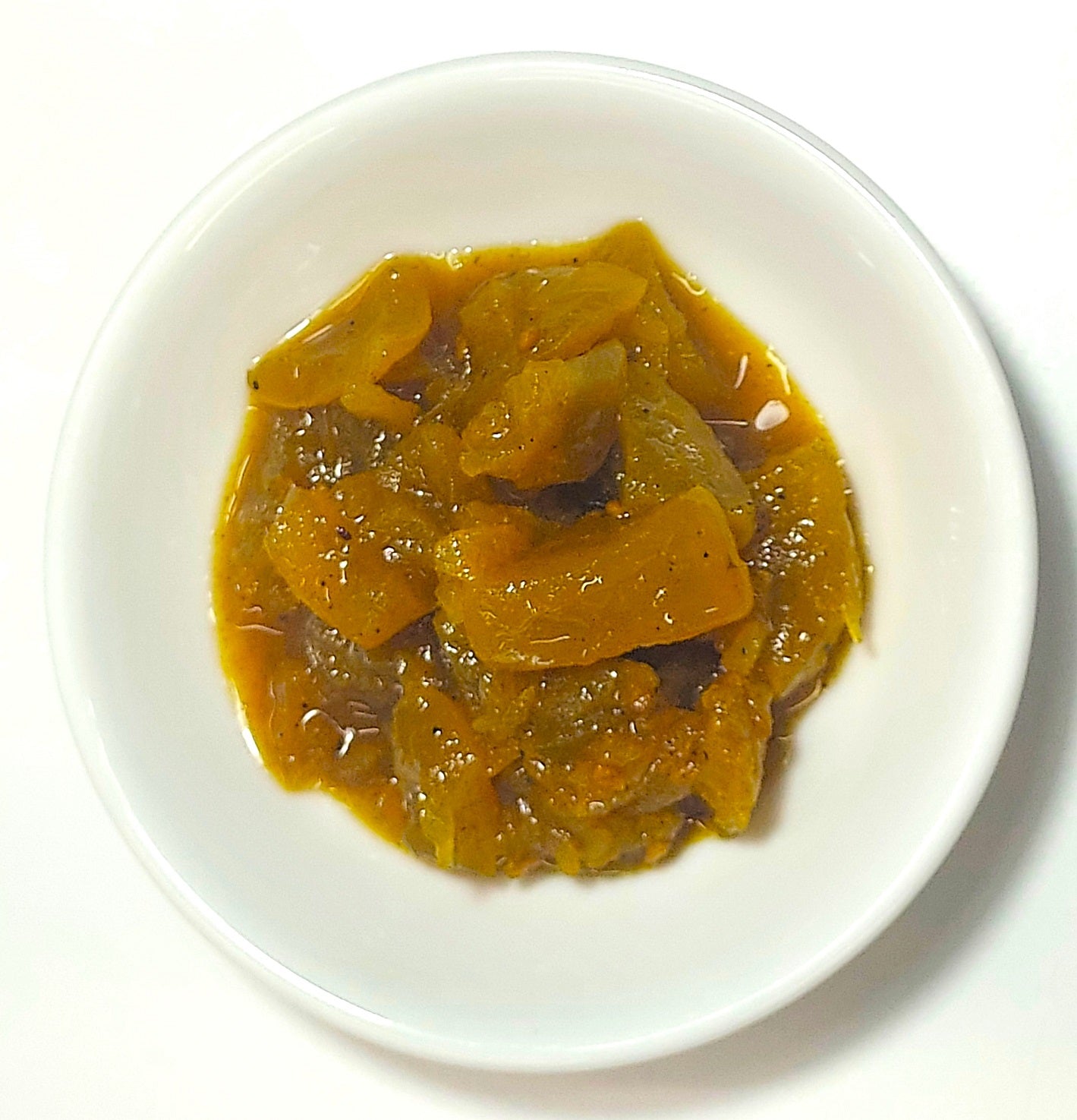 Range Tasmania green tomato and pepperberry pickles served in a small white dish