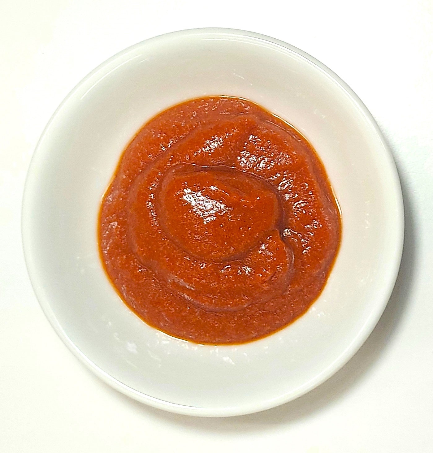 Range Tasmania tomato mustard sauce served in a small white dish