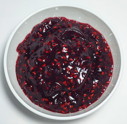 a white bowl of range Tasmania raspberry jam